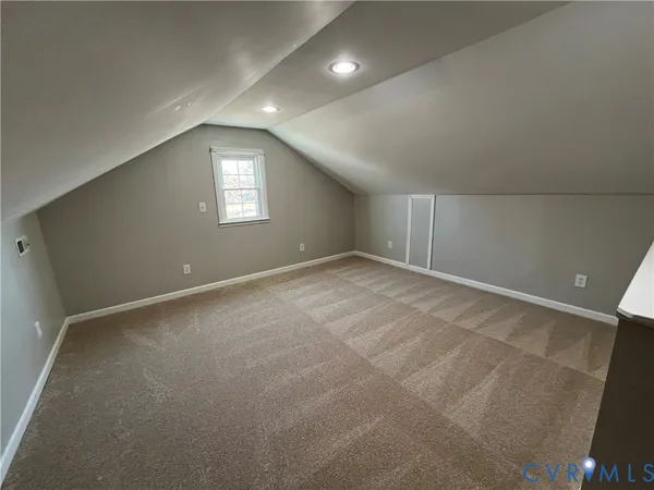 an entryway with wooden floor and a sink