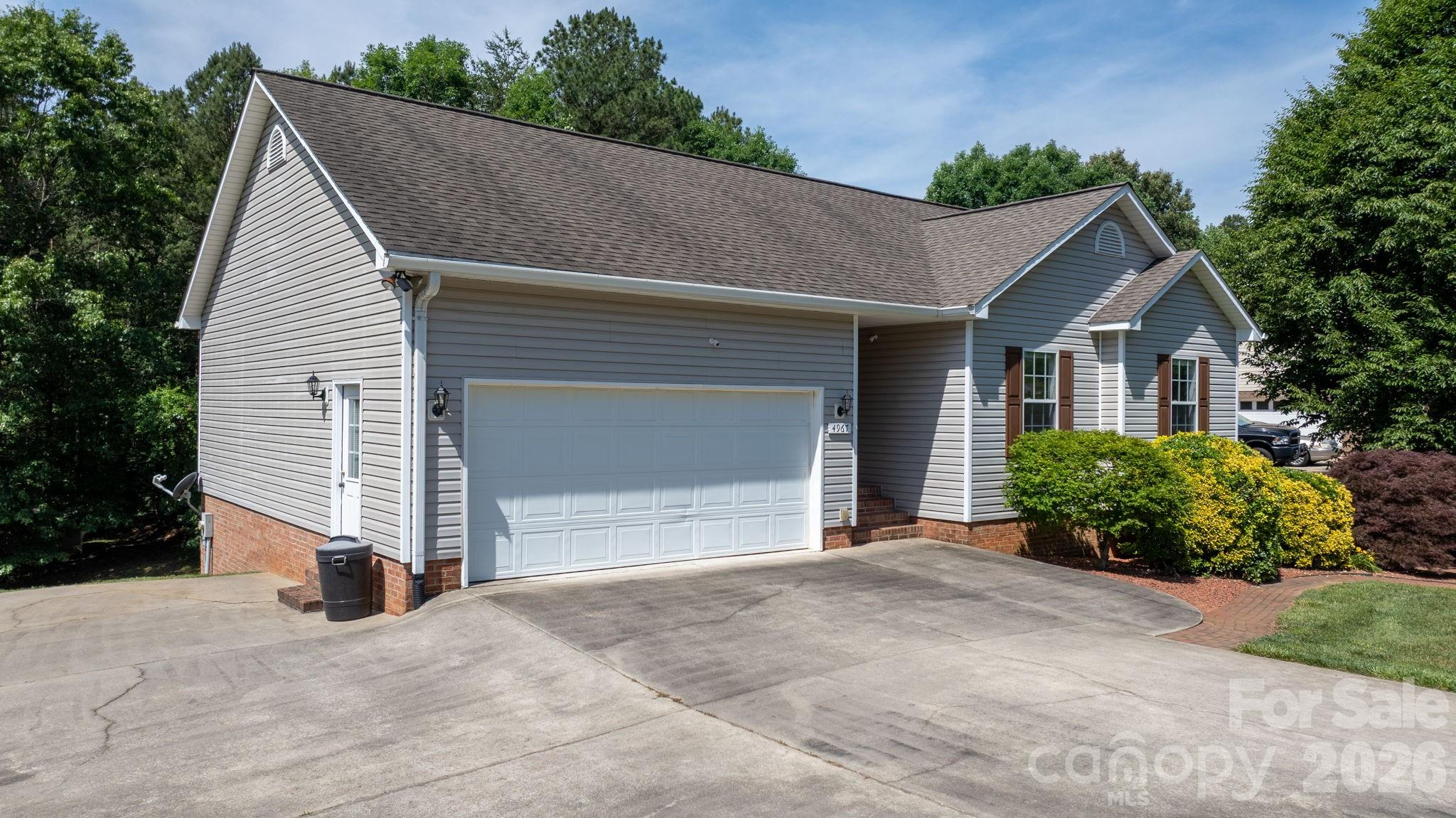 4967 Addison Lane Hickory, NC 28601 - Photo 2 of 43 a view of a house with garage and plants