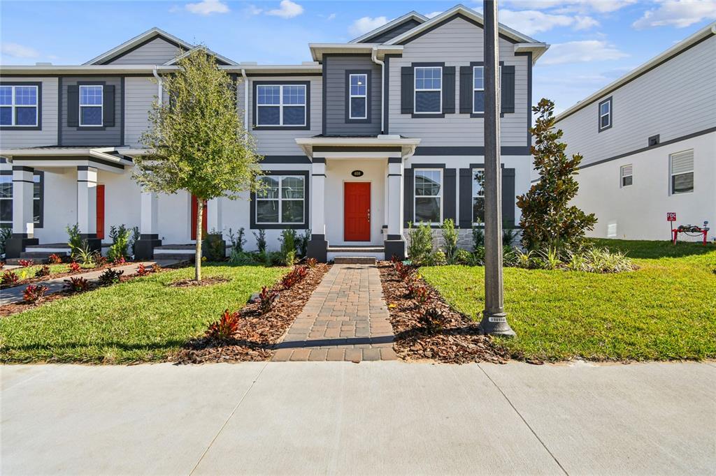 a front view of a house with garden