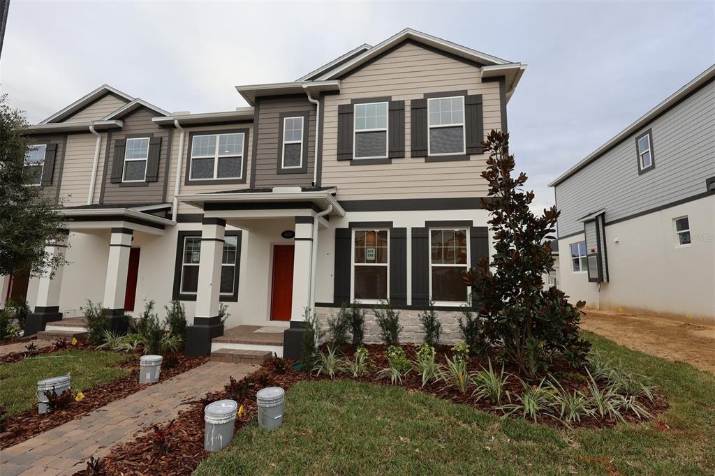 front view of a house with a yard