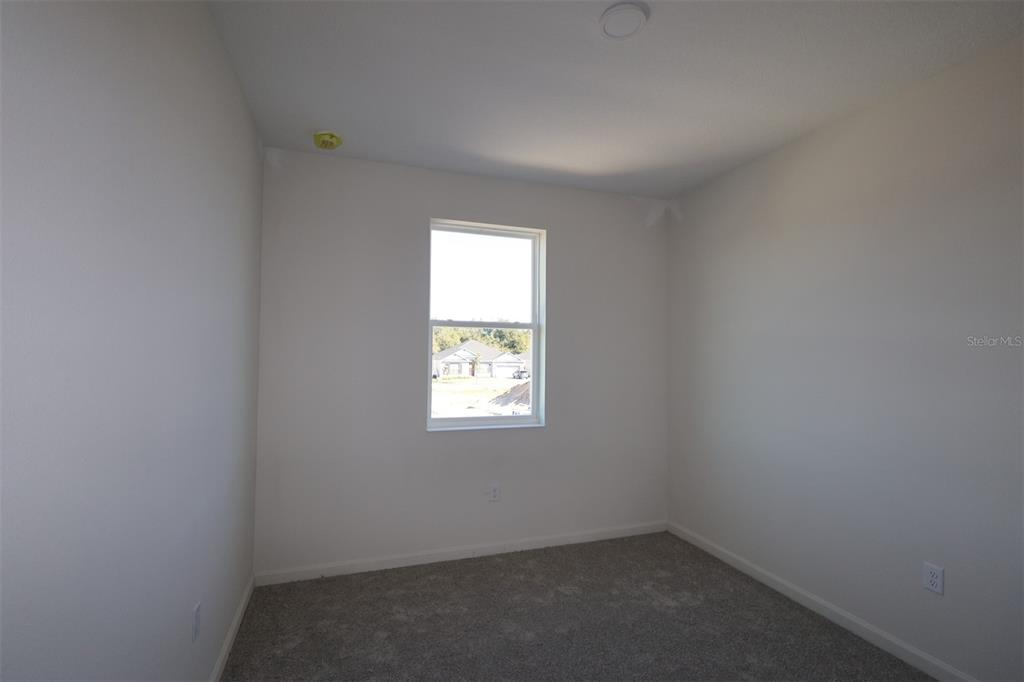 659 Pothos Street Apopka, FL 32703 - Photo 13 of 34 an empty room with a window