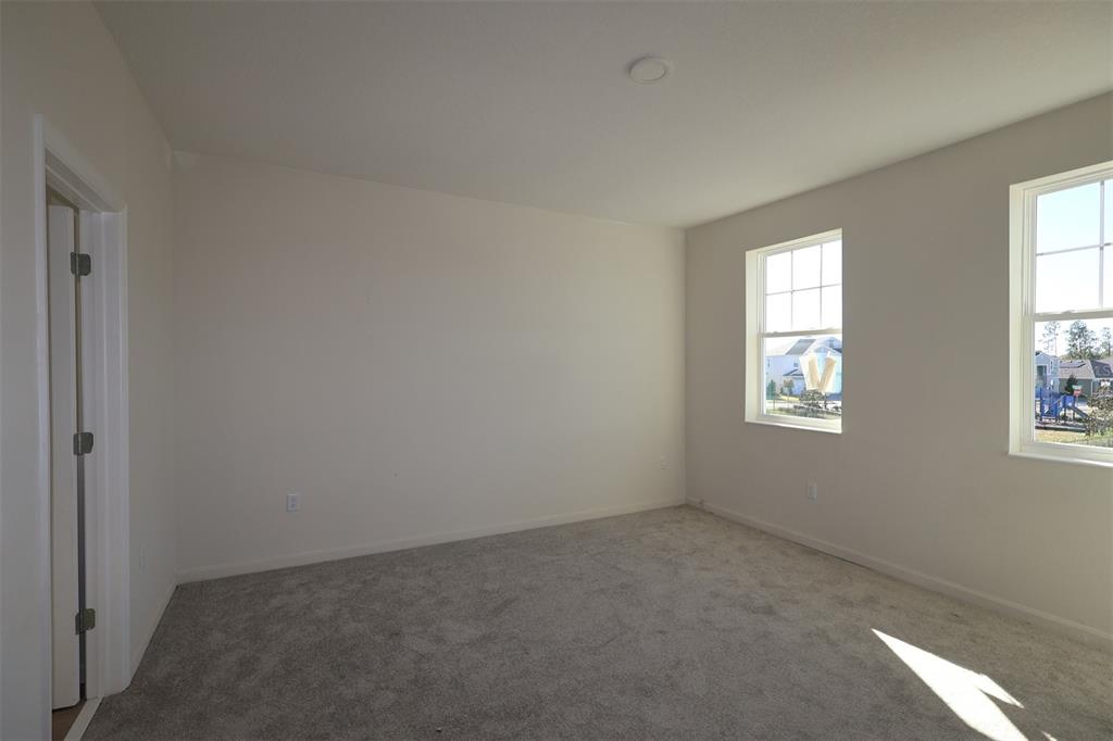 659 Pothos Street Apopka, FL 32703 - Photo 16 of 34 an empty room with windows