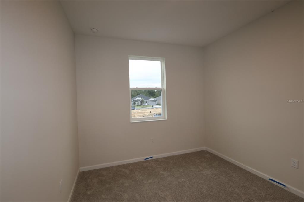 659 Pothos Street Apopka, FL 32703 - Photo 17 of 34 an empty room with a window