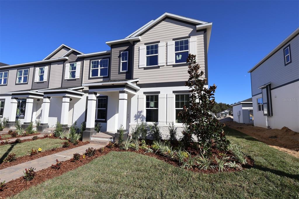 659 Pothos Street Apopka, FL 32703 - Photo 2 of 34 a front view of a house with a yard