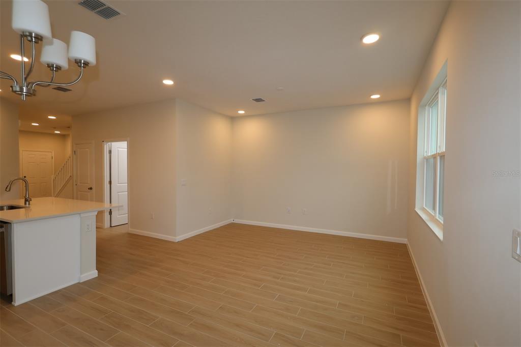659 Pothos Street Apopka, FL 32703 - Photo 21 of 34 a view of a room with wooden floor and a window