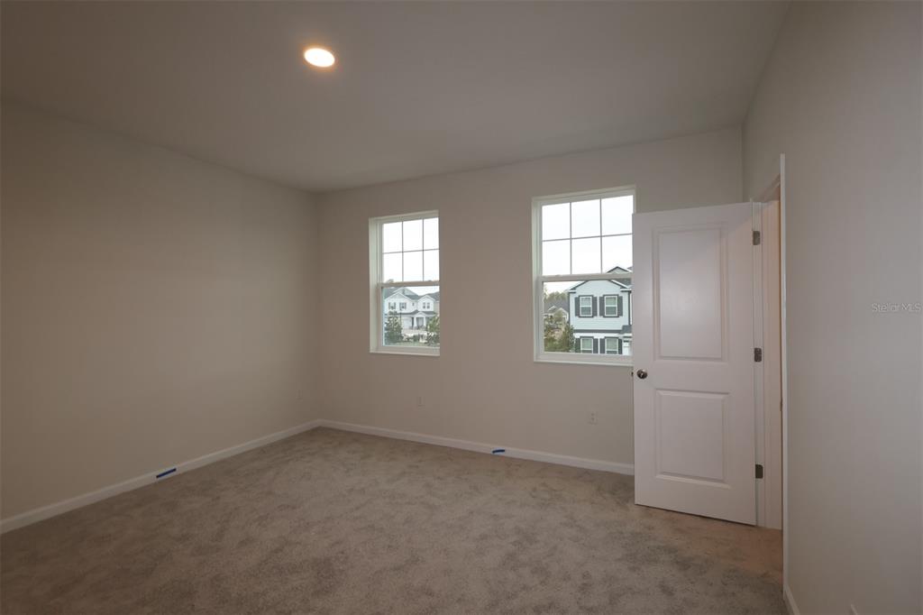 659 Pothos Street Apopka, FL 32703 - Photo 23 of 34 an empty room with windows