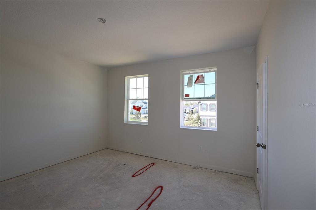 659 Pothos Street Apopka, FL 32703 - Photo 6 of 34 an empty room with windows