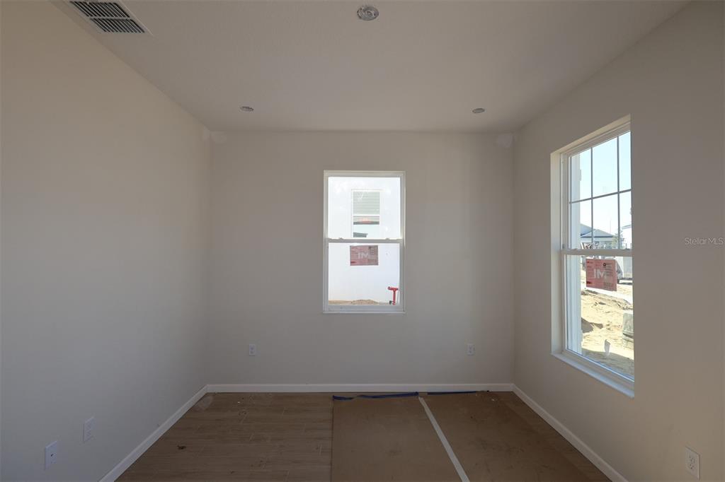 659 Pothos Street Apopka, FL 32703 - Photo 9 of 34 an empty room with a window