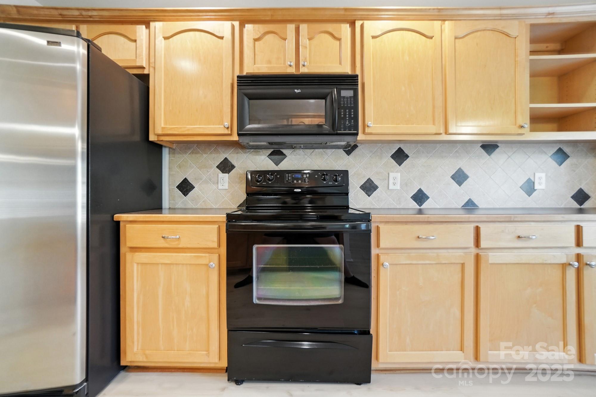 708 Redah Avenue Locust, NC 28097 - Photo 14 of 48 a kitchen with a stove and a microwave