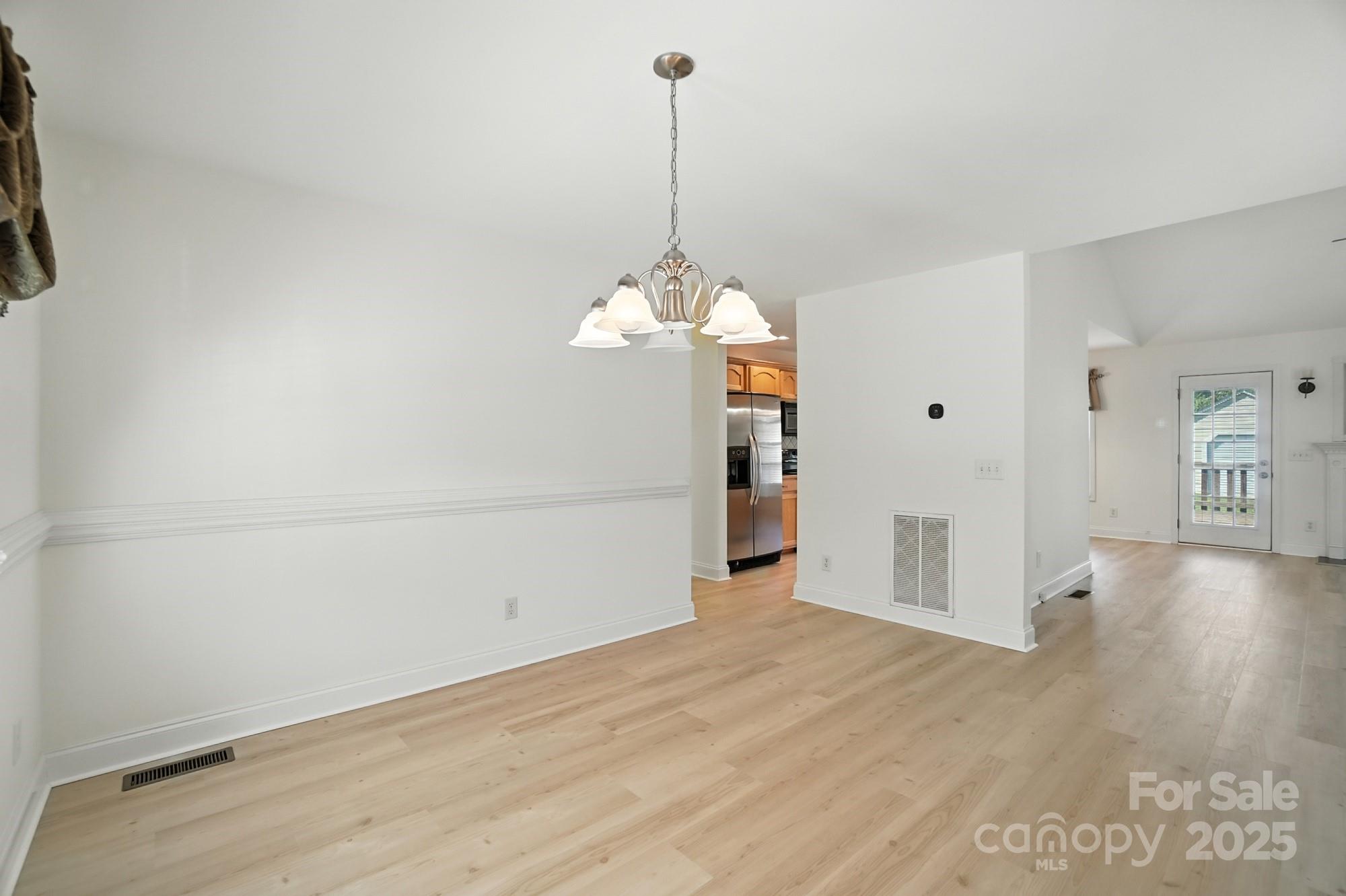 708 Redah Avenue Locust, NC 28097 - Photo 17 of 48 a view of a room with wooden floor and window