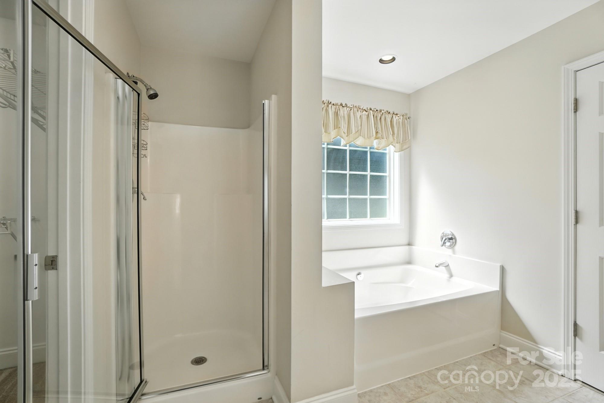 708 Redah Avenue Locust, NC 28097 - Photo 24 of 48 a bathroom with a bathtub sink and shower