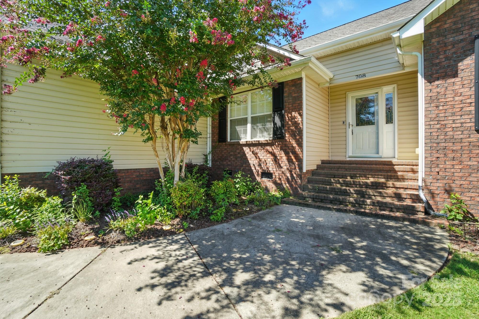 708 Redah Avenue Locust, NC 28097 - Photo 3 of 48 a front view of a house with garden