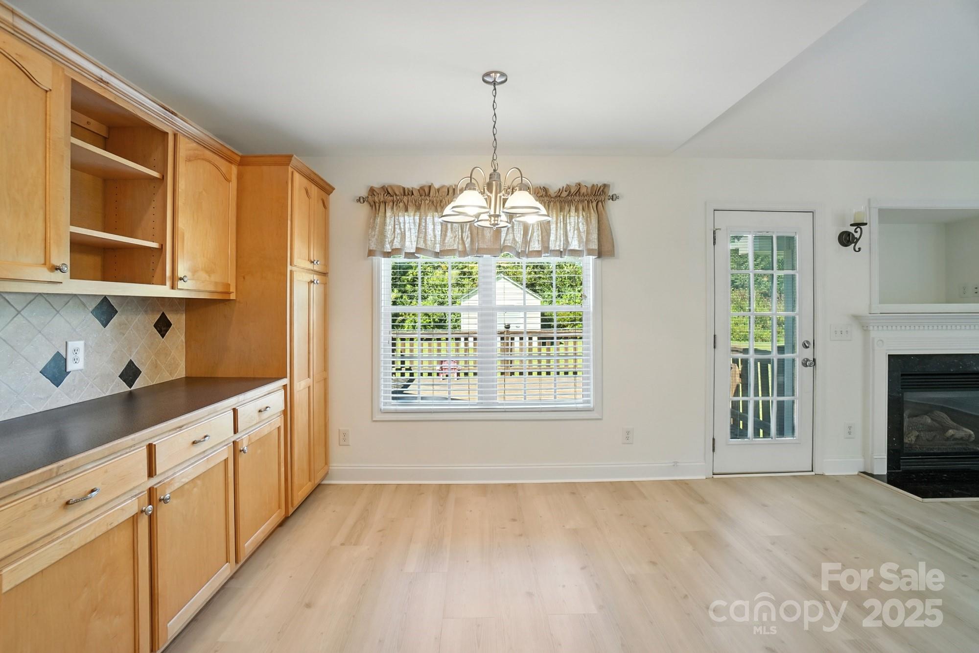 708 Redah Avenue Locust, NC 28097 - Photo 10 of 48 a view of a kitchen with microwave and windows