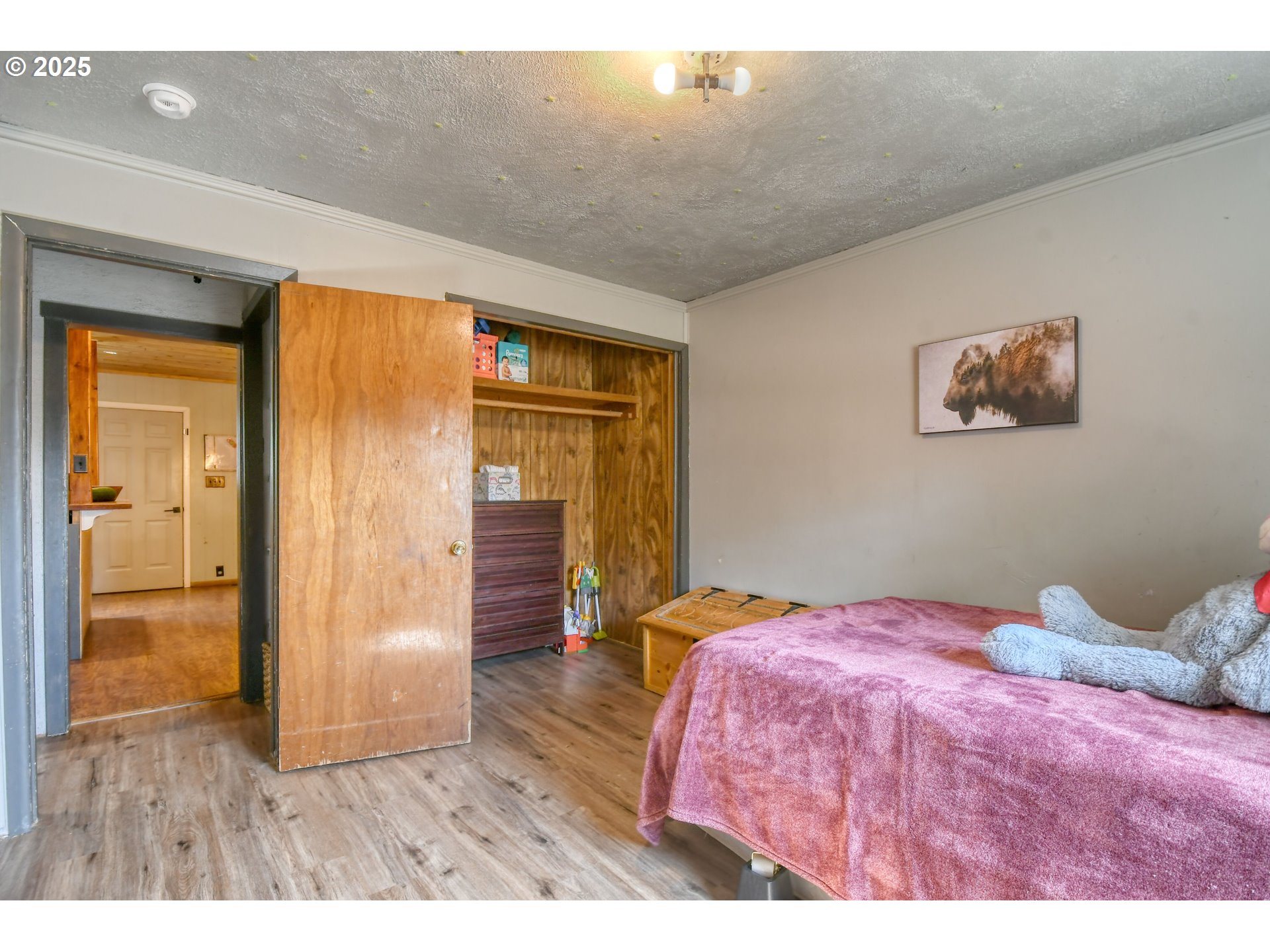 559 Southwest Cedar Street Pilot Rock, OR 97868 - Photo 26 of 42 a bedroom with a bed and a painting on the wall
