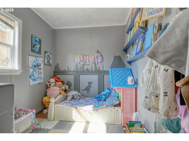a bed room with a bed and a book shelf