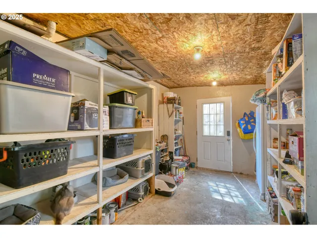 a view of livingroom with furniture and cabinet