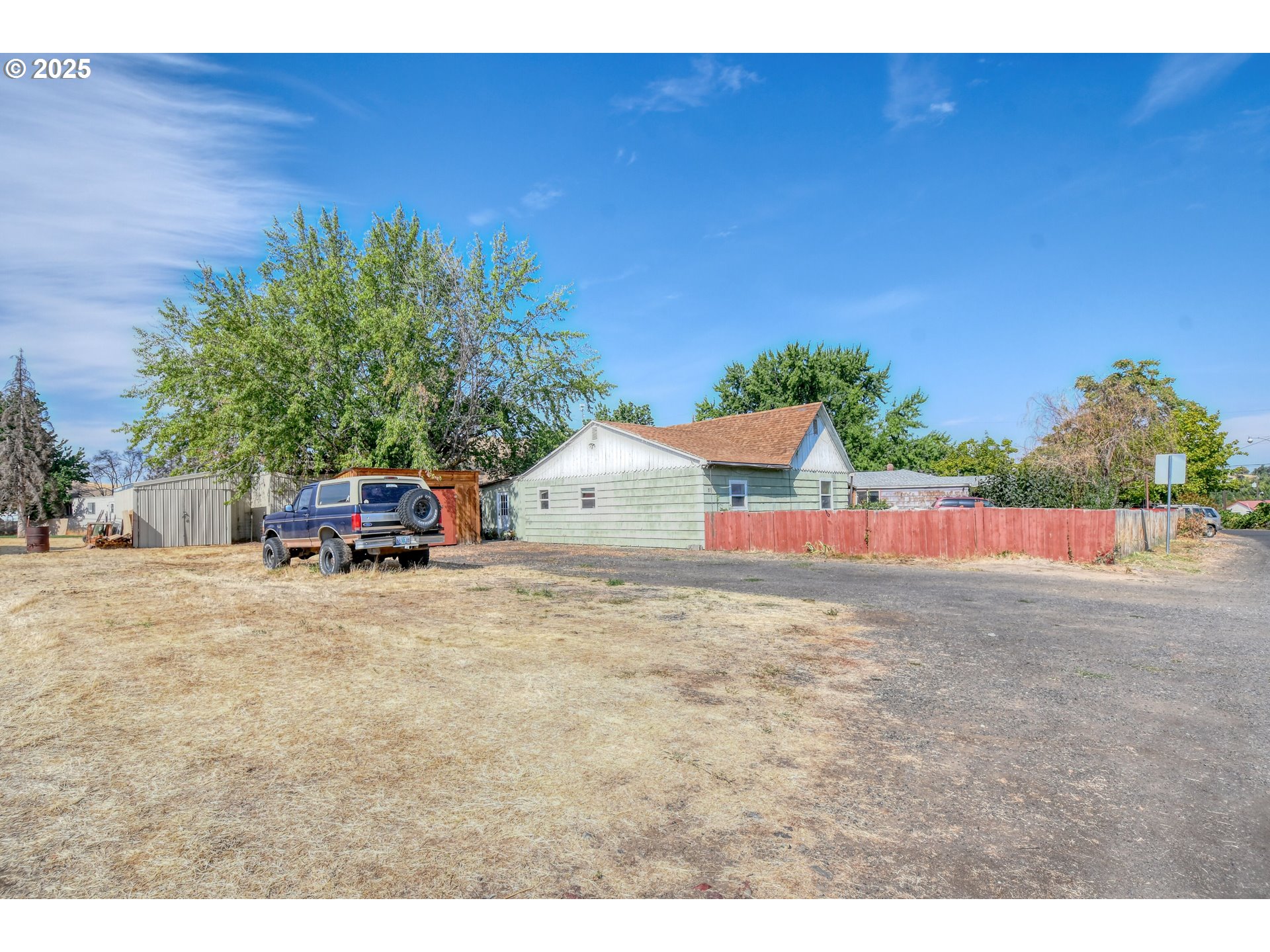 559 Southwest Cedar Street Pilot Rock, OR 97868 - Photo 10 of 42 a view of a house with a yard and car parked