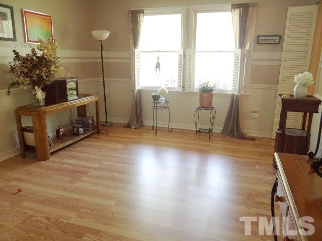 6717 Hammersmith Drive Raleigh, NC 27613 - Photo 8 of 20 a view of a workspace with furniture and a window