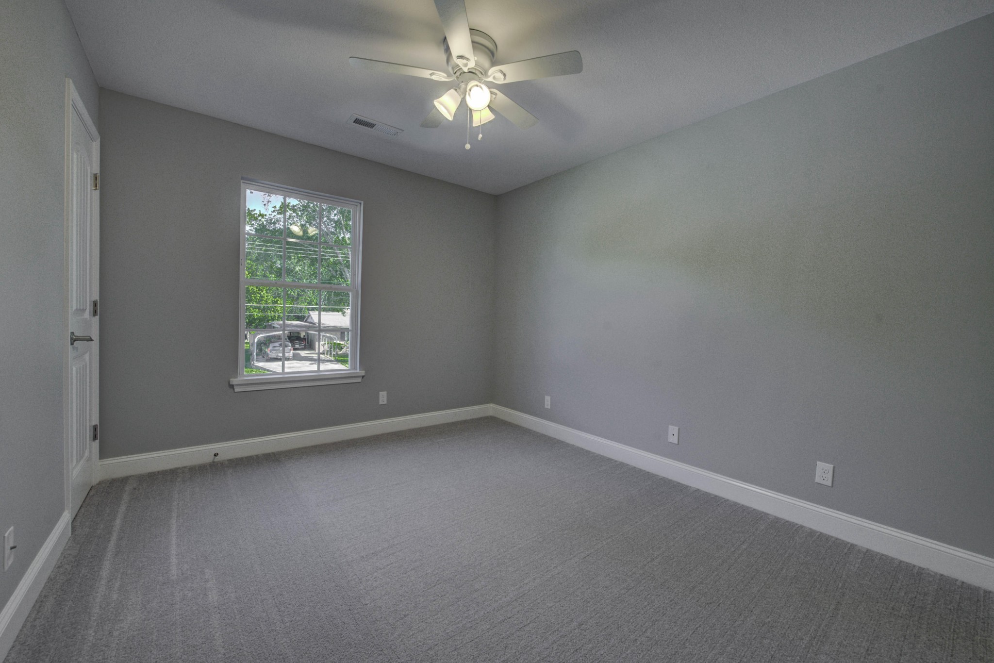 127 West Lincoln Road Oak Ridge, TN 37830 - Photo 17 of 32 an empty room with a window and a fan