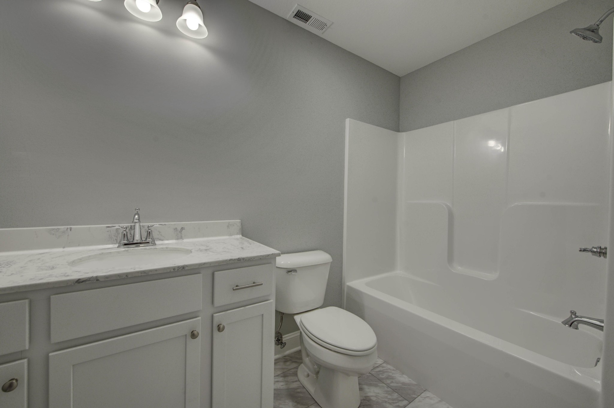 127 West Lincoln Road Oak Ridge, TN 37830 - Photo 22 of 32 a bathroom with a granite countertop sink toilet and shower