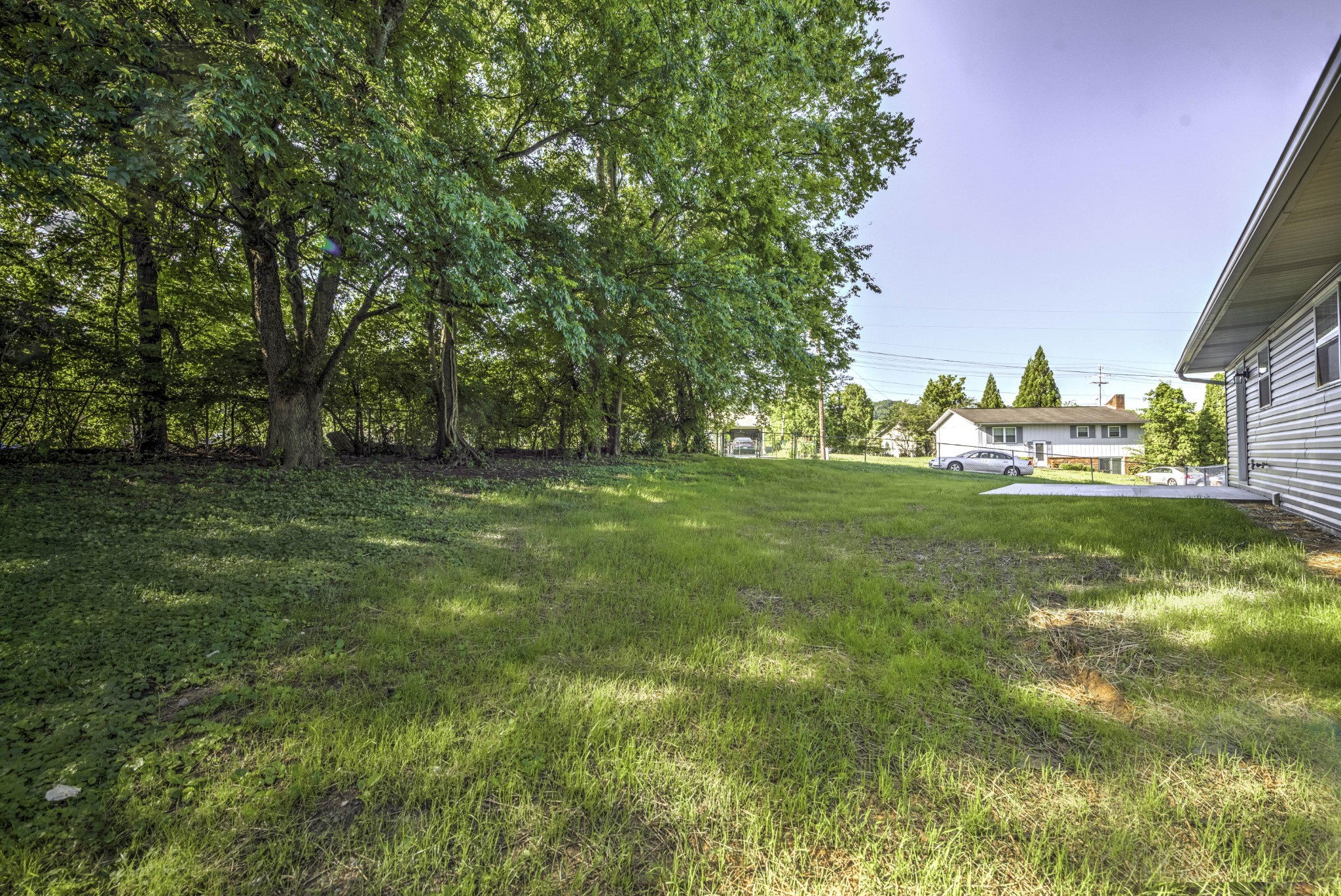 127 West Lincoln Road Oak Ridge, TN 37830 - Photo 32 of 32 a grassy field with trees in the background