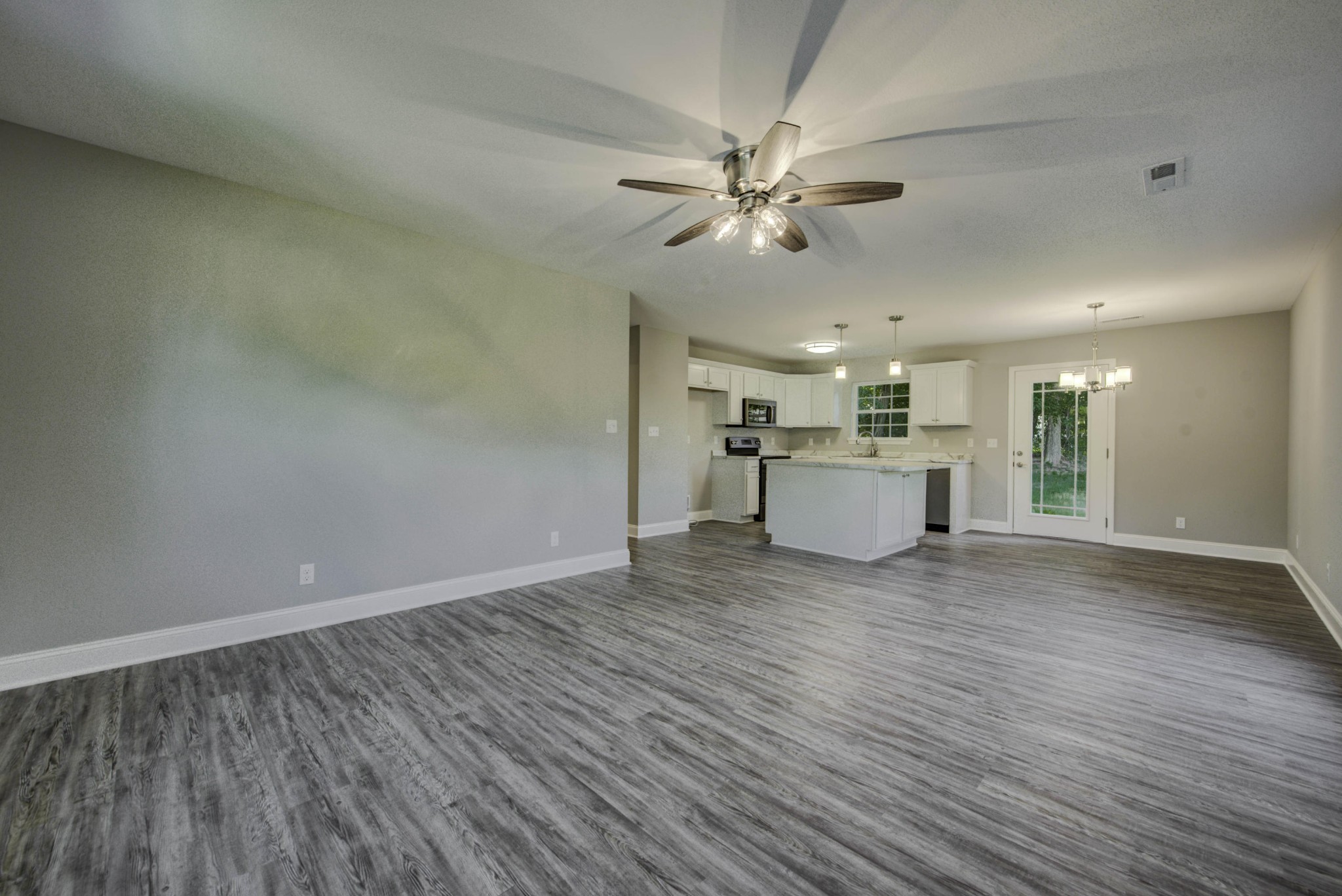 127 West Lincoln Road Oak Ridge, TN 37830 - Photo 8 of 32 a view of a livingroom with a kitchen counter tops and wooden floor