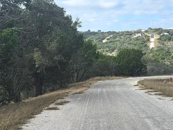 a view of a street with sitting area