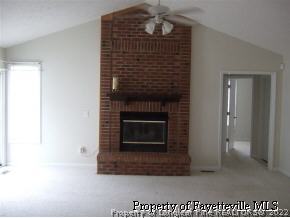 122 Chesapeake Road Cameron, NC 28326 - Photo 4 of 10 a living room with a fireplace