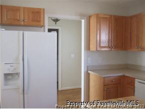 122 Chesapeake Road Cameron, NC 28326 - Photo 8 of 10 a view of a kitchen with appliances and cabinets