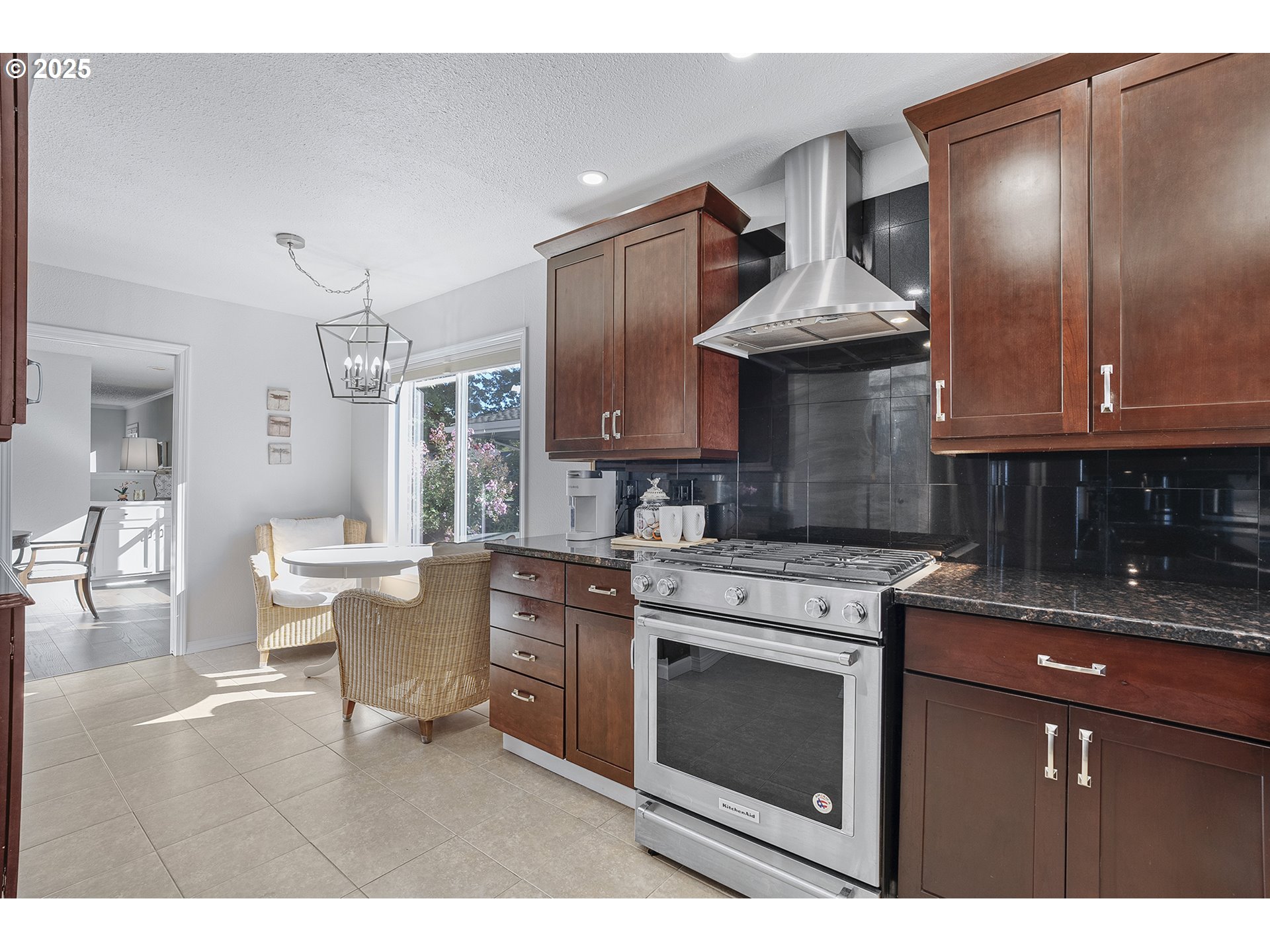32215 Southwest East Lake Point Wilsonville, OR 97070 - Photo 12 of 47 a kitchen with stainless steel appliances granite countertop a stove a sink dishwasher and cabinets with wooden floor