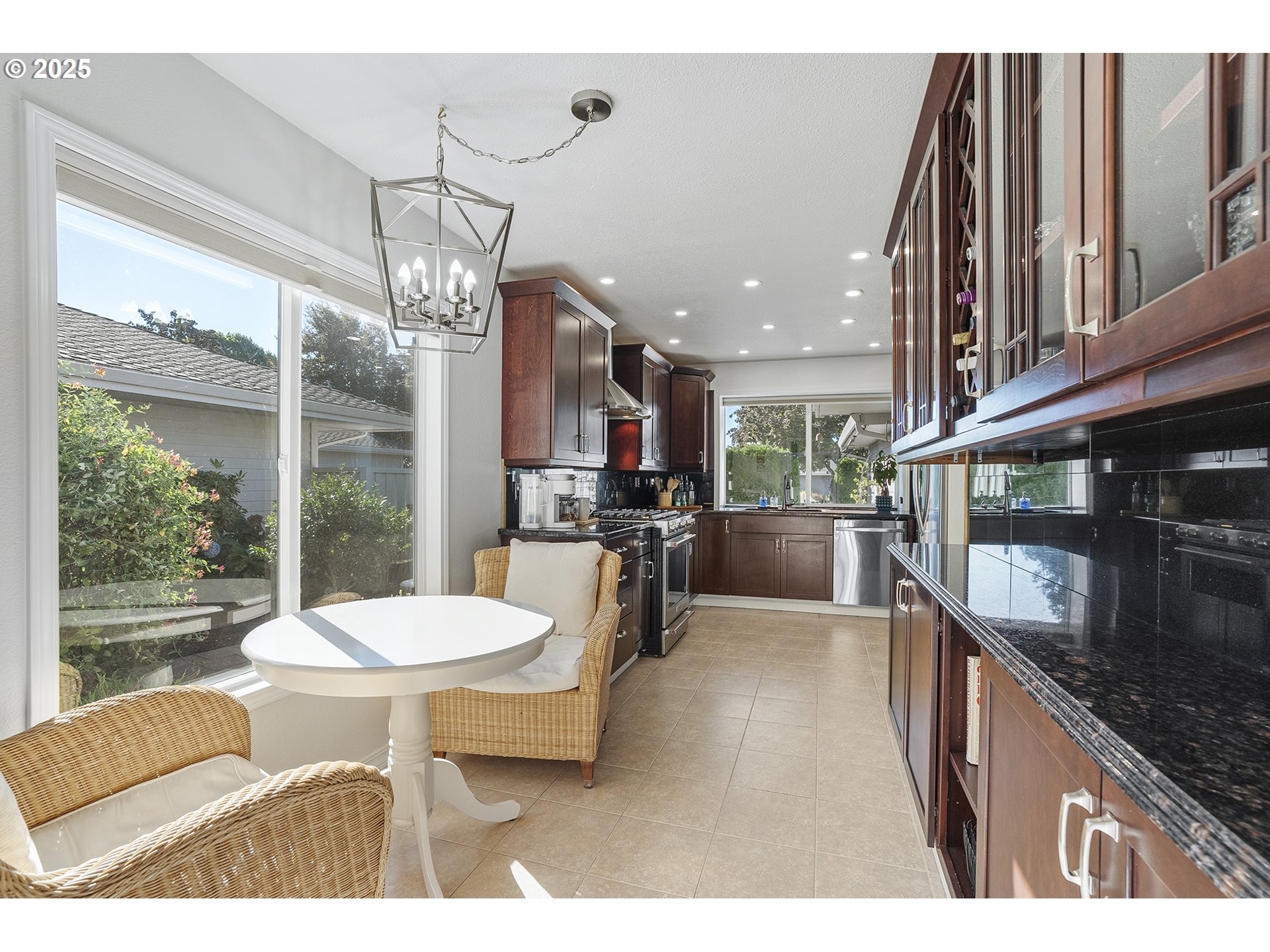 32215 Southwest East Lake Point Wilsonville, OR 97070 - Photo 14 of 47 a open kitchen with stainless steel appliances kitchen island granite countertop a sink and cabinets