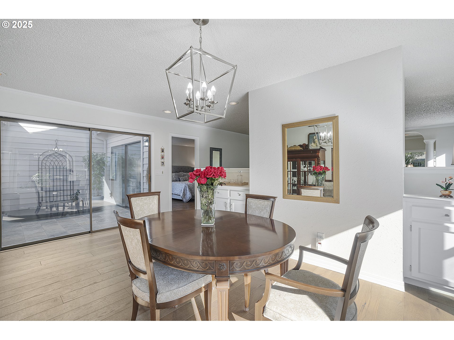 32215 Southwest East Lake Point Wilsonville, OR 97070 - Photo 17 of 47 a view of a dining room with furniture wooden floor and chandelier