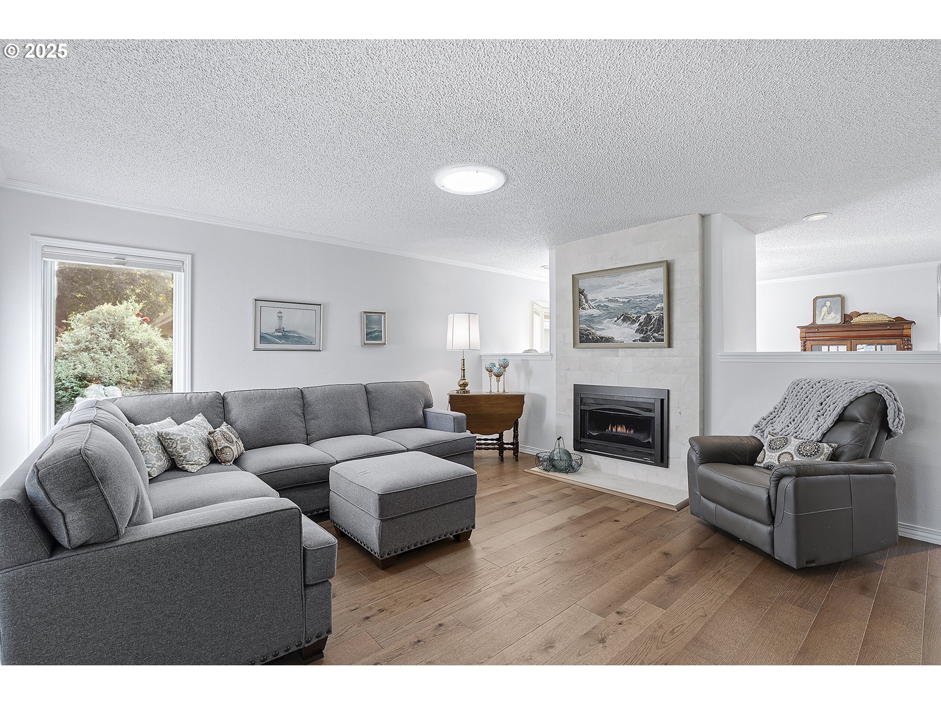 32215 Southwest East Lake Point Wilsonville, OR 97070 - Photo 19 of 47 a living room with furniture and a fireplace