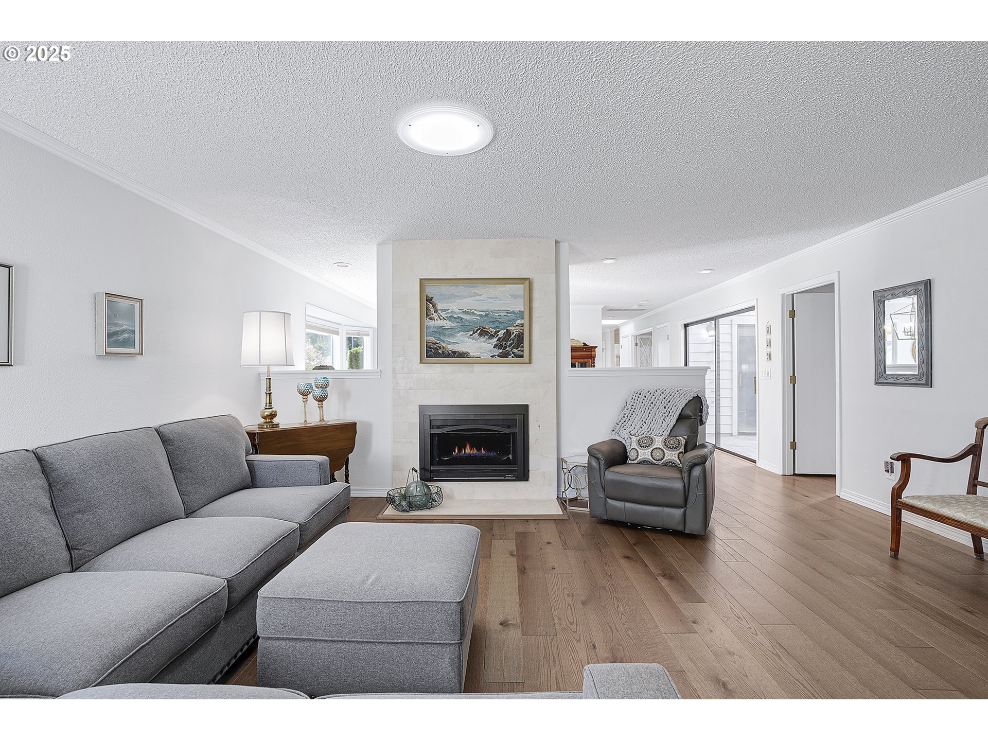 32215 Southwest East Lake Point Wilsonville, OR 97070 - Photo 20 of 47 a living room with furniture and a fireplace
