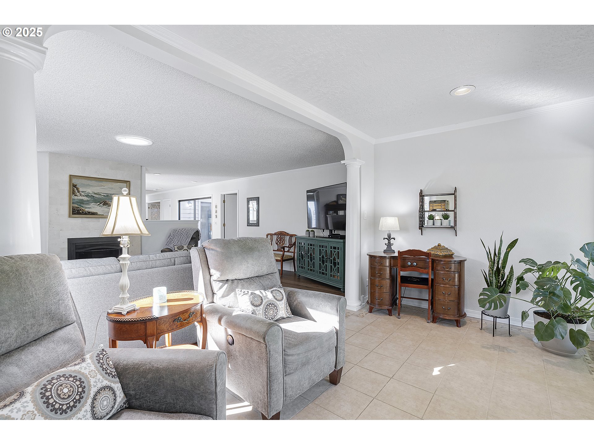 32215 Southwest East Lake Point Wilsonville, OR 97070 - Photo 23 of 47 a living room with furniture and a fireplace