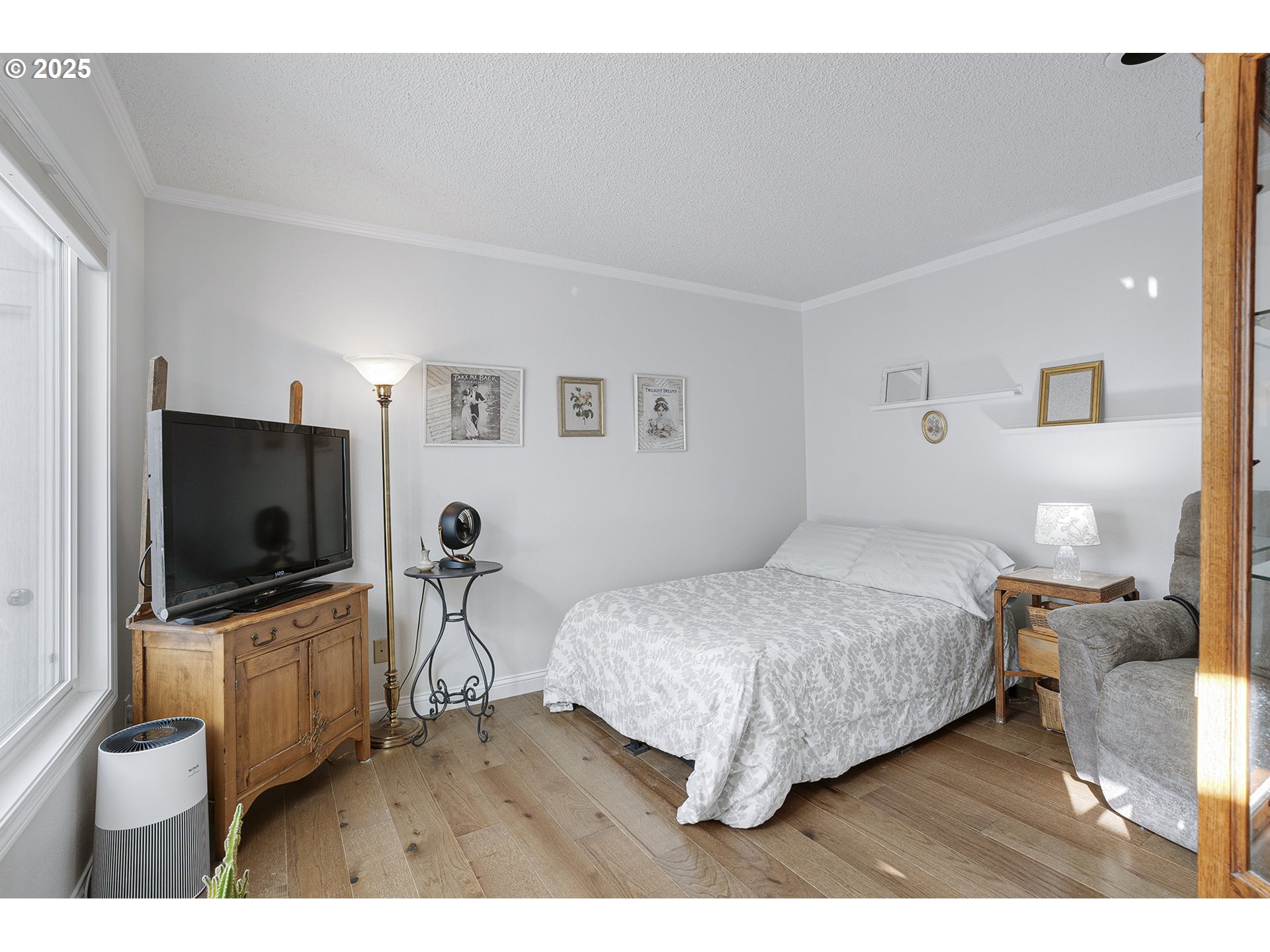 32215 Southwest East Lake Point Wilsonville, OR 97070 - Photo 24 of 47 a bedroom with a bed and a flat screen tv