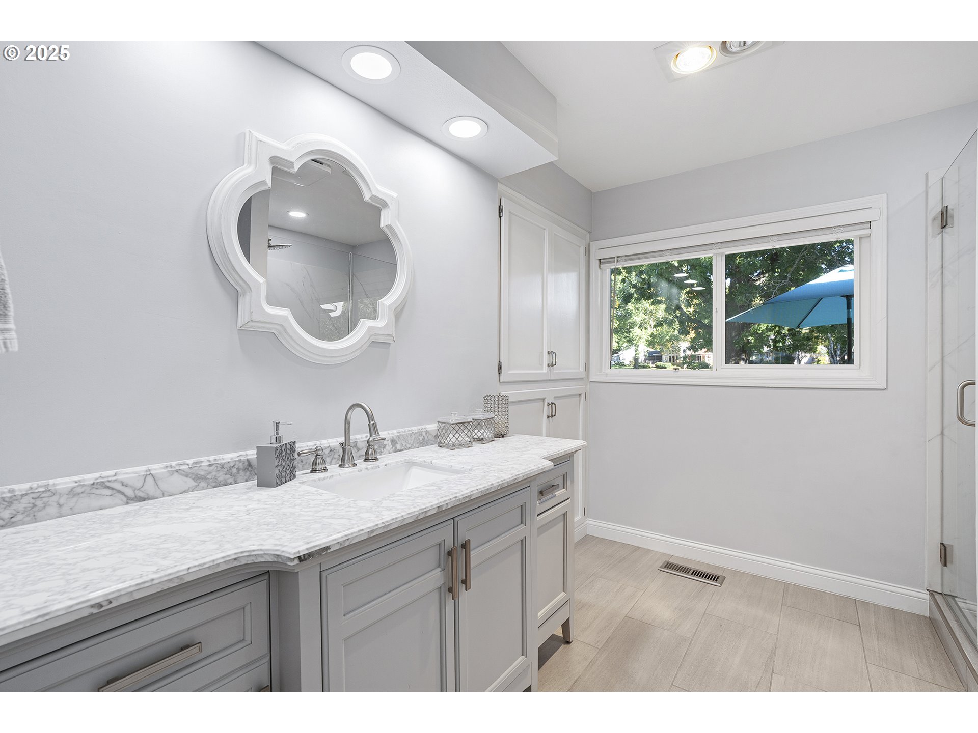 32215 Southwest East Lake Point Wilsonville, OR 97070 - Photo 33 of 47 a bathroom with a granite countertop a sink and a mirror