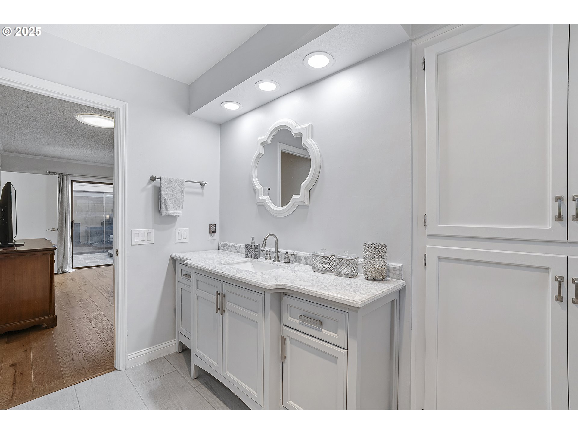 32215 Southwest East Lake Point Wilsonville, OR 97070 - Photo 36 of 47 a en suite bathroom with a sink and a mirror