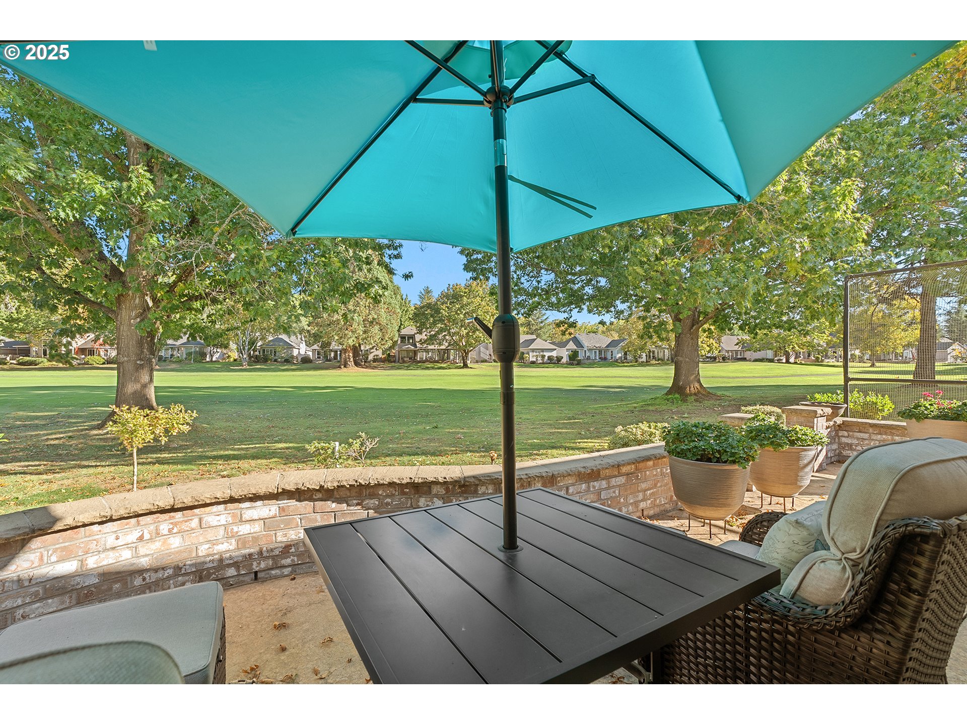 32215 Southwest East Lake Point Wilsonville, OR 97070 - Photo 41 of 47 a view of a patio with a table chairs under an umbrella