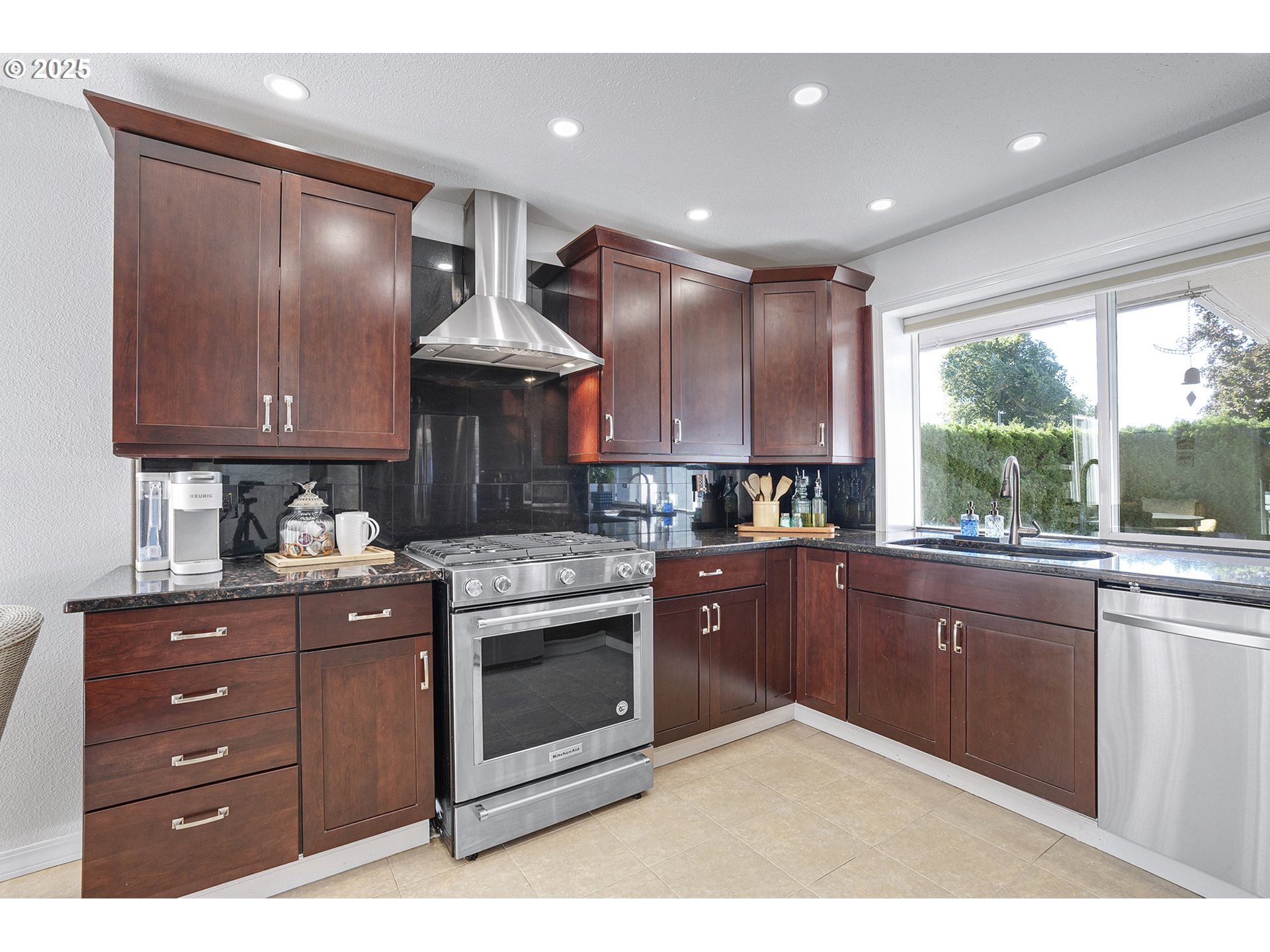 32215 Southwest East Lake Point Wilsonville, OR 97070 - Photo 9 of 47 a kitchen with a stove sink and cabinets