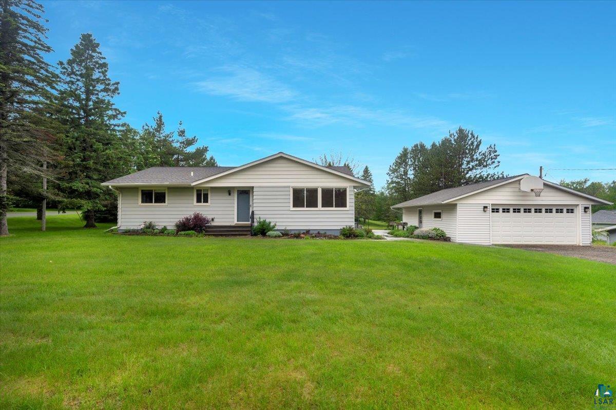 5219 West Arrowhead Road Hermantown, MN 55811 - Photo 1 of 35 Ranch-style home featuring a garage and a front yard