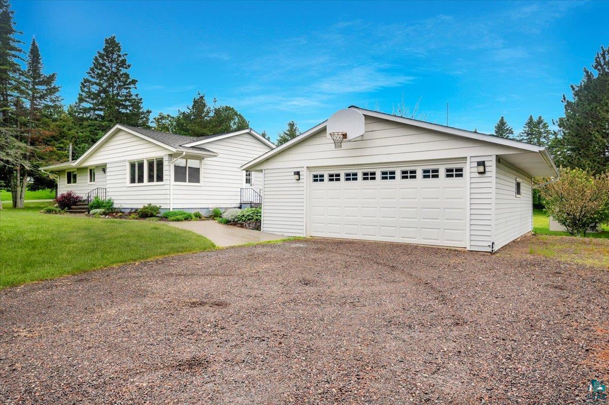 5219 West Arrowhead Road Hermantown, MN 55811 - Photo 16 of 35 Ranch-style house featuring a garage and a front lawn