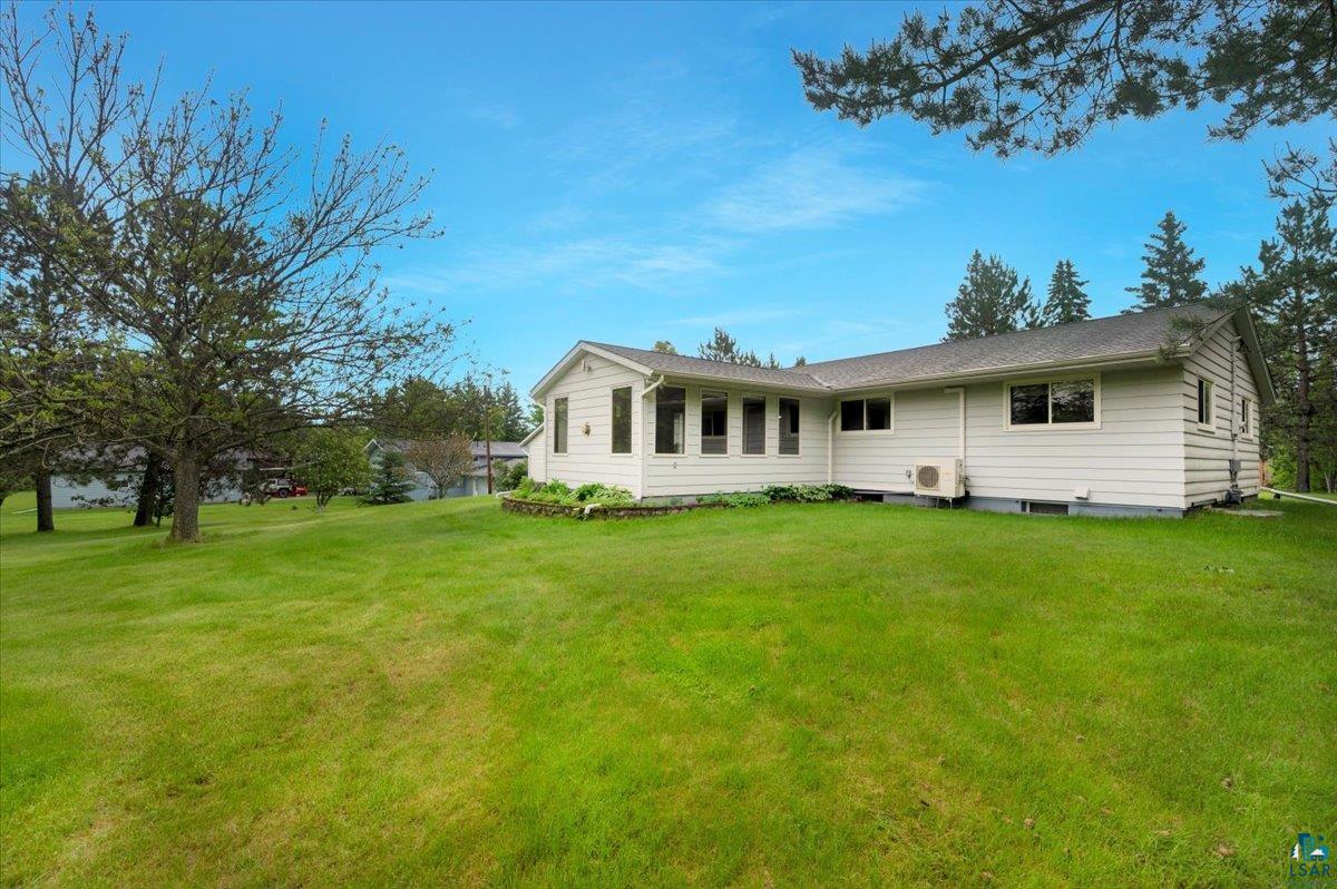 5219 West Arrowhead Road Hermantown, MN 55811 - Photo 29 of 35 Rear view of property featuring a yard