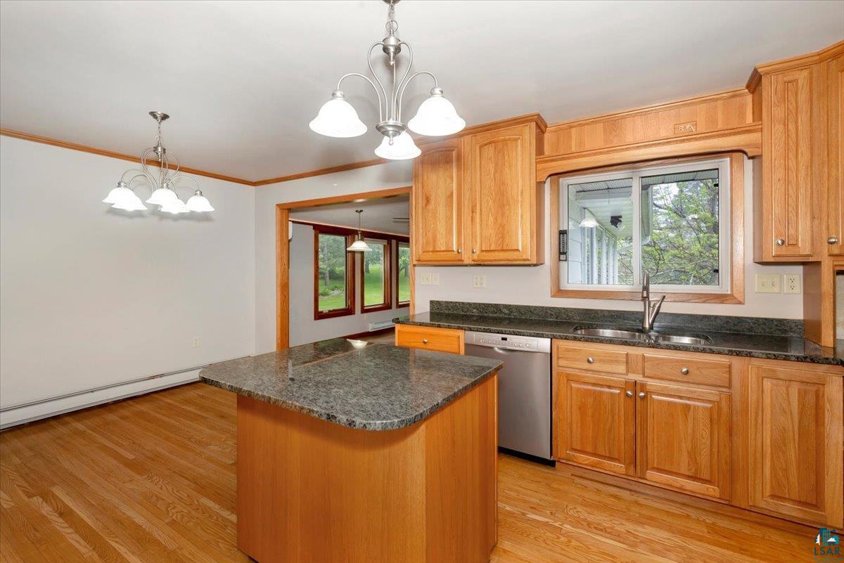 5219 West Arrowhead Road Hermantown, MN 55811 - Photo 5 of 35 Kitchen featuring dishwasher, sink, light wood-type flooring, and a healthy amount of sunlight