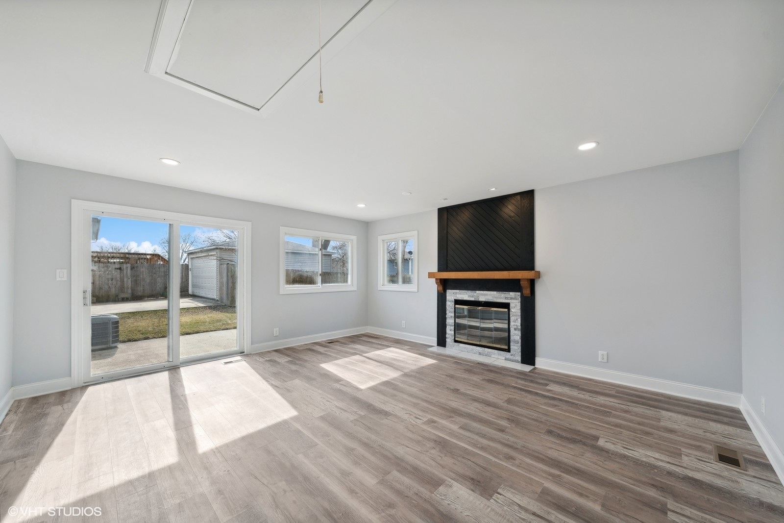 129 Springleaf Drive Bolingbrook, IL 60440 - Photo 12 of 14 a view of empty room with wooden floor and fireplace