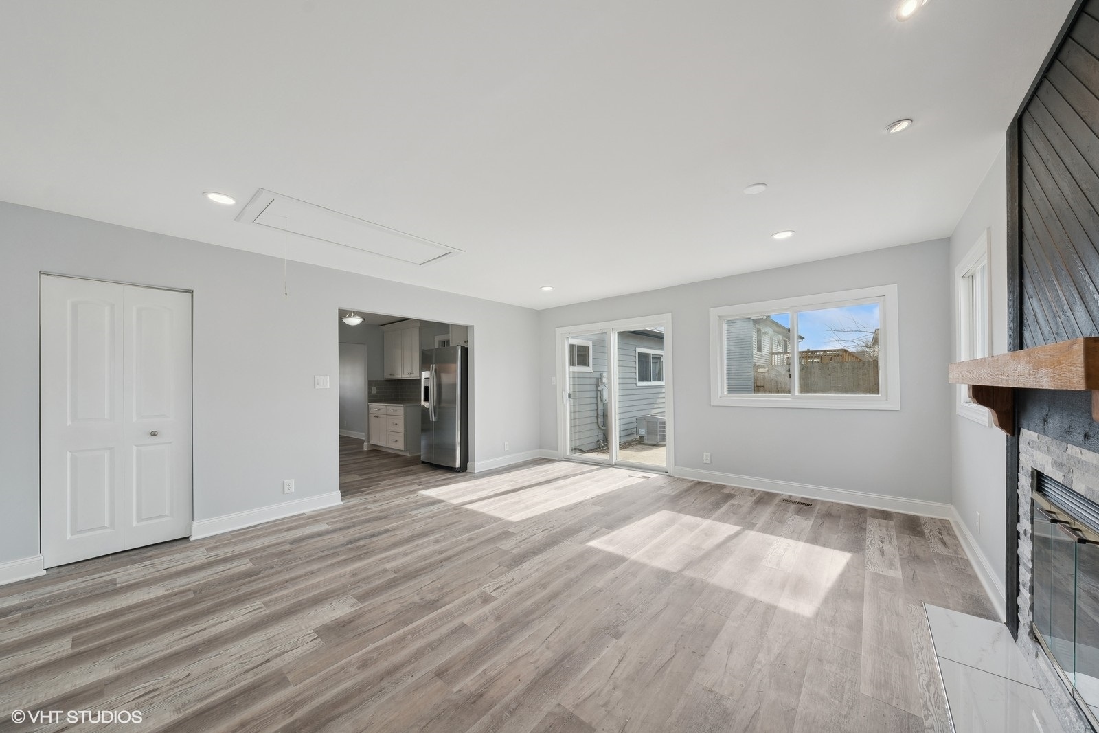 129 Springleaf Drive Bolingbrook, IL 60440 - Photo 6 of 14 a view of an empty room with a window and wooden floor