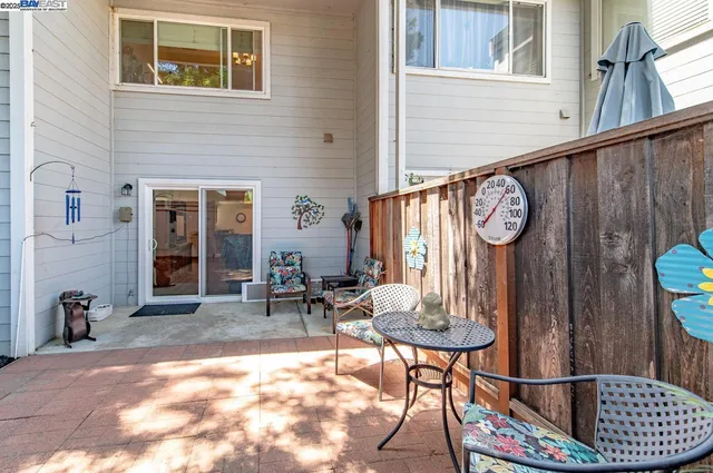 a view of a chairs and table in the balcony