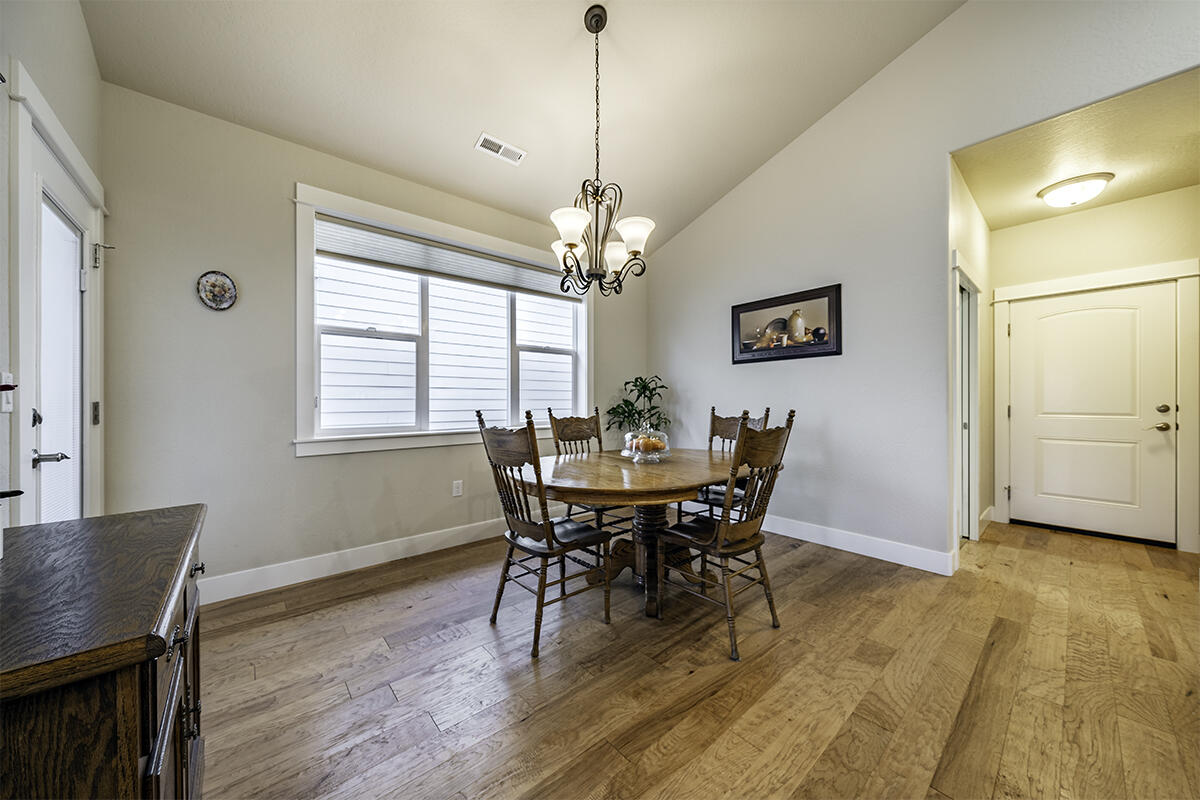 1078 North Haskell Street Central Point, OR 97502 - Photo 7 of 25 a view of a dining room with furniture window and wooden floor