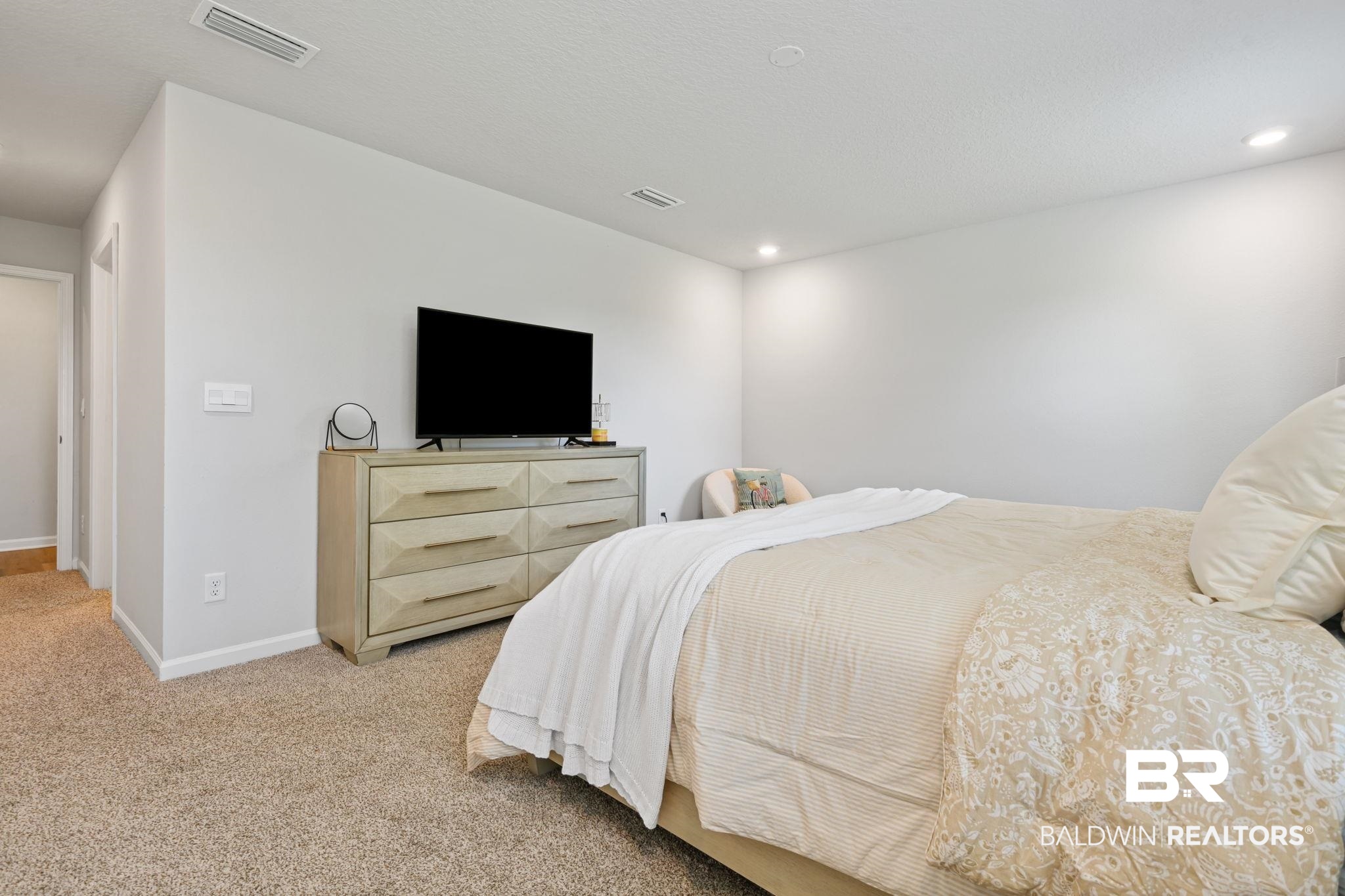8021 Valor Rdg Way North Mobile, AL 36619 - Photo 34 of 34 Wall-to-wall carpeting in a neutral tone and recessed ceiling lighting throughout