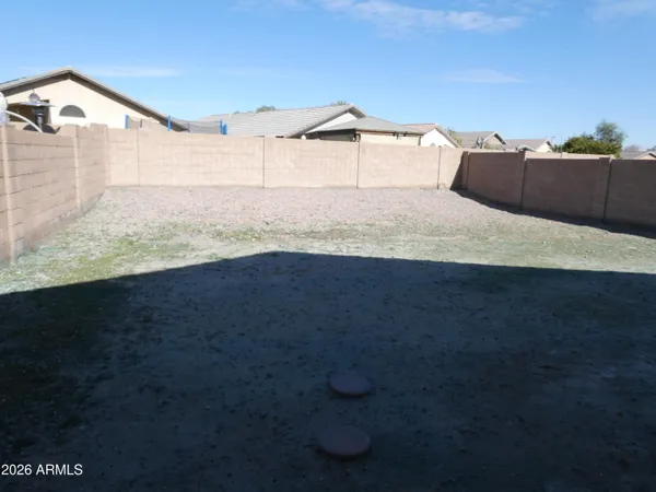 a view of a big yard with a house